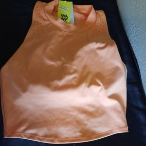 Women's size Medium orange athletic crop top.